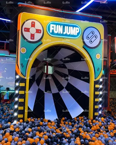 FUN JUMP themed indoor playground ball pit slide with colorful plastic balls, game console-inspired entrance, and neon lighting