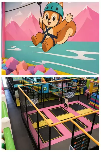 Vibrant indoor kids play space at Little Champs Playland, featuring pastel foam block pit with cartoon squirrel zip line wall art and multi-pink padded trampoline zone surrounded by safety netting and multi-level soft play climbing frames