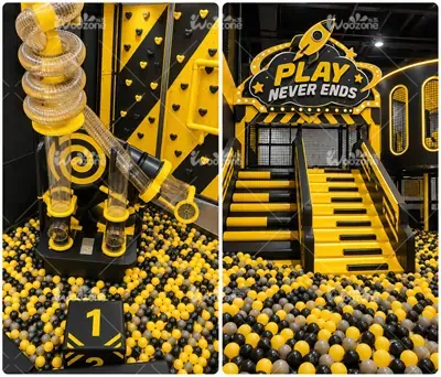 Black and yellow indoor macaron ball pit playground equipment with spiraling ball tube and climbing area