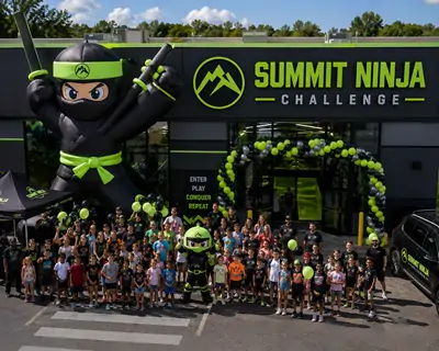 The grand opening of Summit Ninja Challenge family entertainment center in Michigan, showcasing the venue entrance and professional indoor amusement center project results.